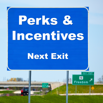 A road sign says "Perks" indicating an article about employees desiring educational benefits offered through their employer.