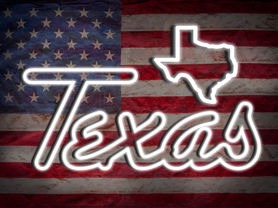 American flag with a neon sign overlay. Sign is in the shape of the state of Texas.