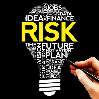 Graphic of a lightbulb emphasizing the word "Risk".